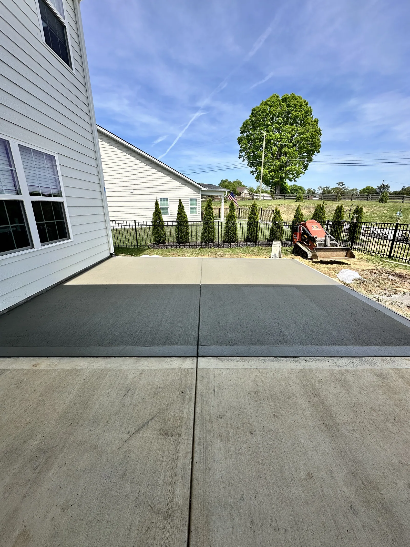 Concrete backyard patio installation Knoxville TN — custom slab by Landscape Around You