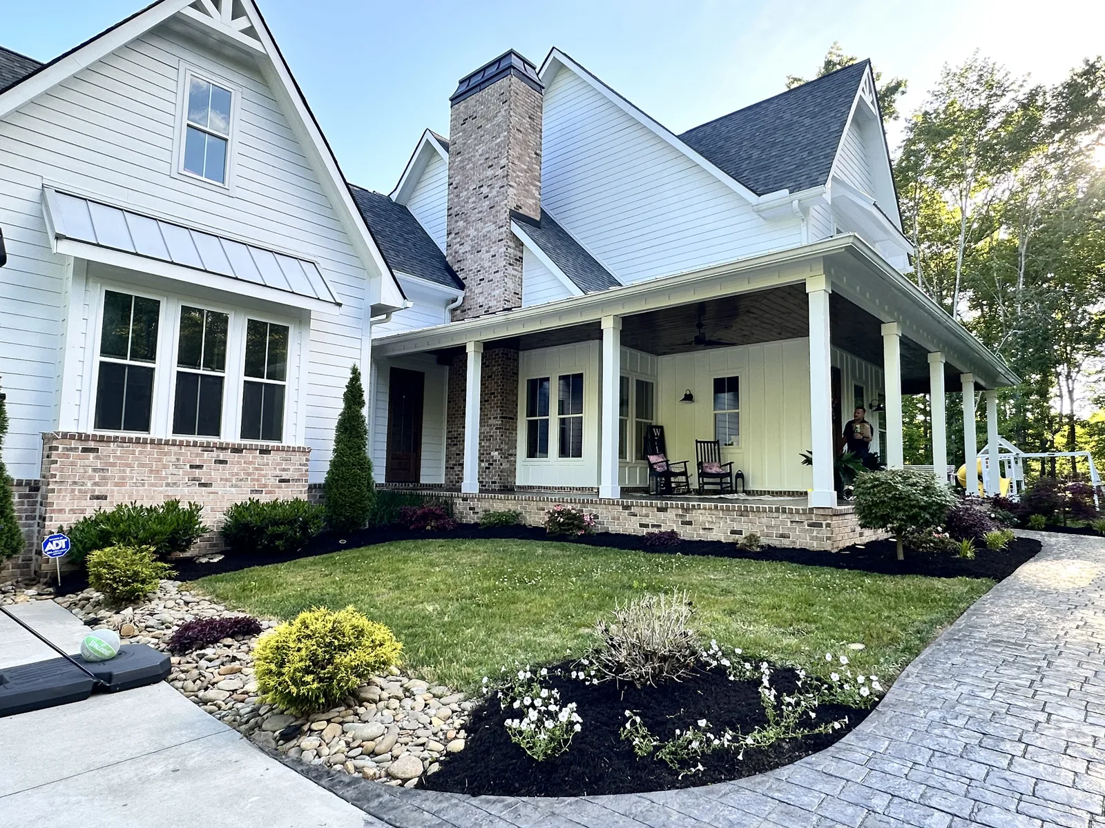 Landscaping design and installation Knoxville TN — mulch beds, shrubs, sod, lawn care